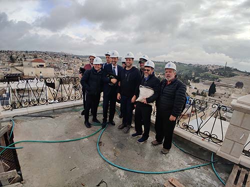 posing on the roof of Tiferet Yisrael